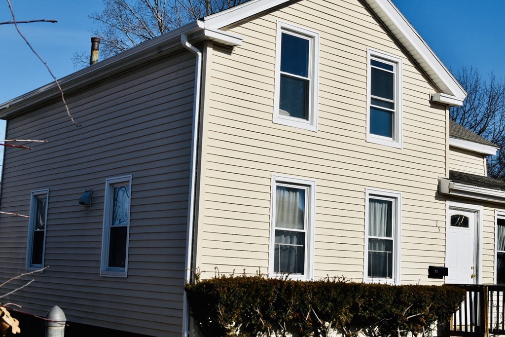 75 White Street Springfield, MA 01108 - Photo 2 of 13 a view of a white house with many windows