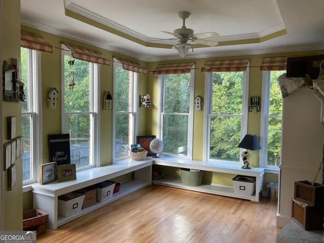 a view of hallway with wooden floor