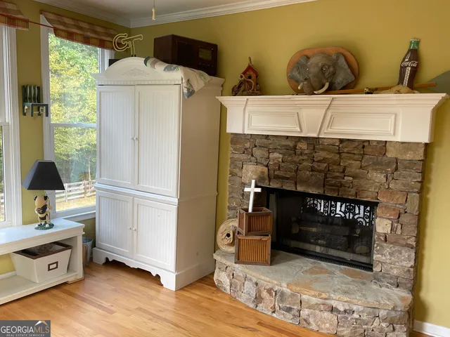 a living room with furniture window and a view of bedroom