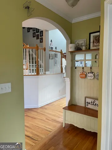 a view of a dining room with furniture and chandelier