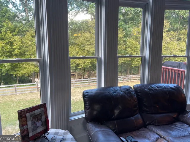 a view of a dining room with furniture chandelier and wooden floor