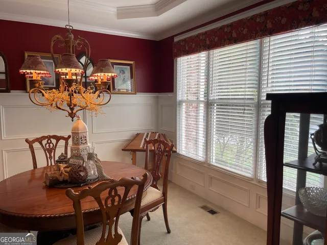 a kitchen with stainless steel appliances granite countertop a sink a stove and a wooden cabinets