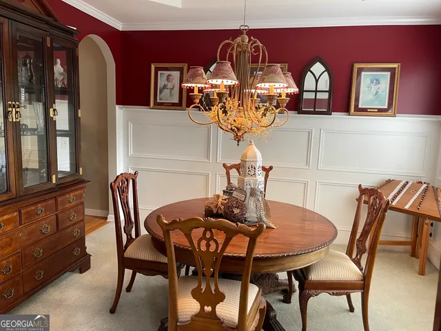 a kitchen with a refrigerator and a stove