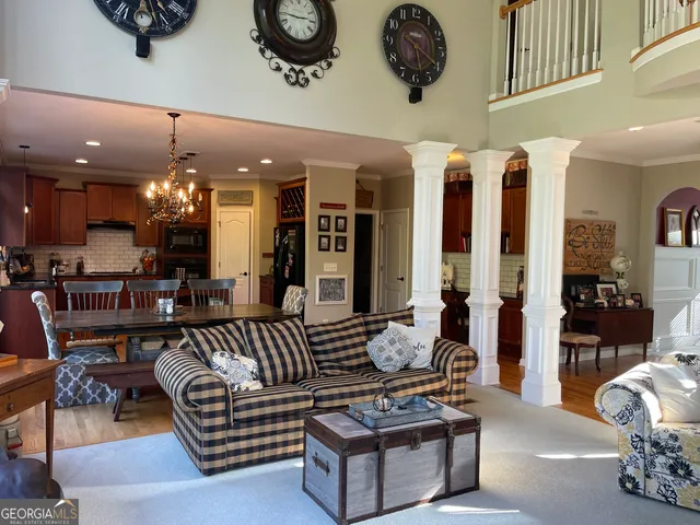 a dining room with furniture and wooden floor