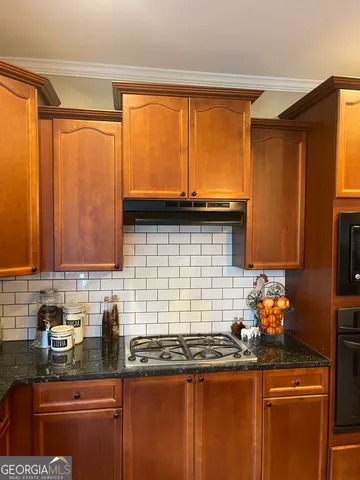 a living room with furniture fireplace and flat screen tv