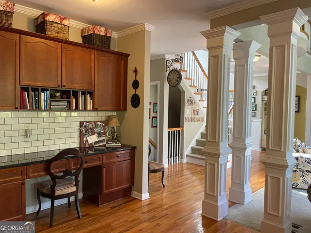 a livingroom with fireplace dining area and a couch