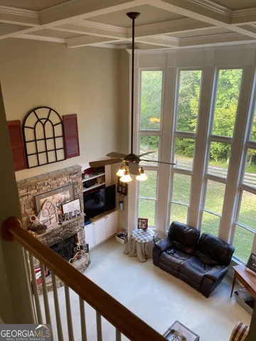 a backyard of a house with barbeque oven table and chairs