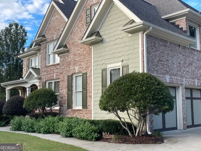 a front view of a house with a yard