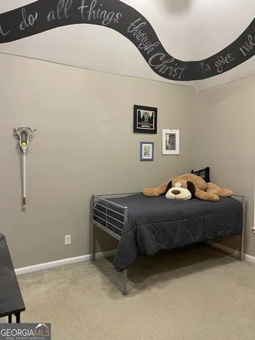 a view of a backyard with lawn chairs and a fire pit