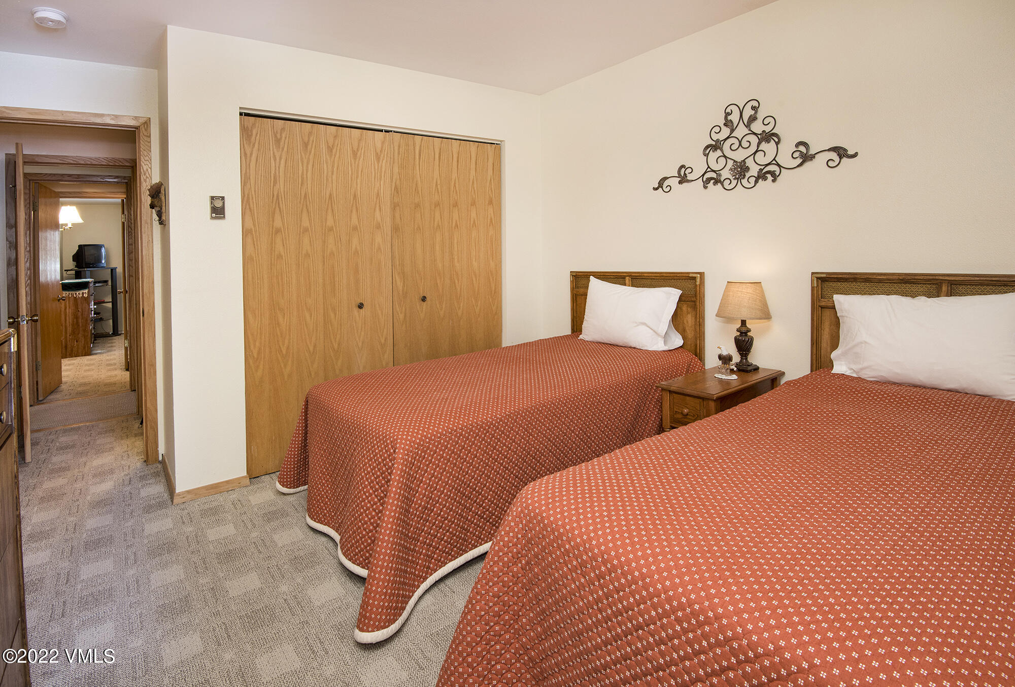 1030 Lions Ridge Loop, Unit 201 Vail, CO 81657 - Photo 19 of 29 a bedroom with two beds and painted walls