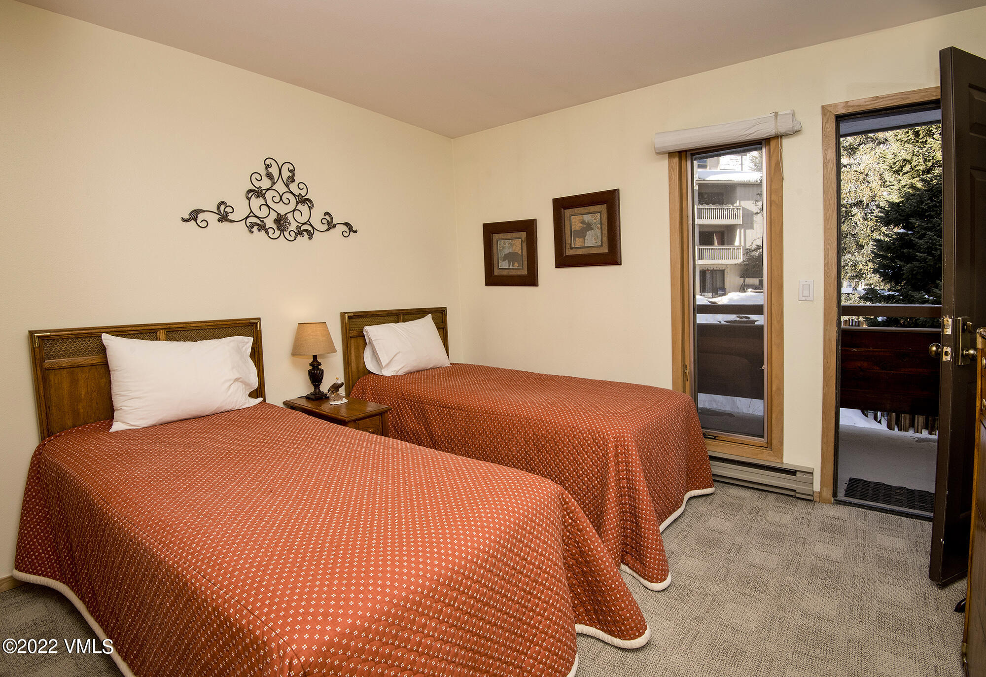 1030 Lions Ridge Loop, Unit 201 Vail, CO 81657 - Photo 20 of 29 a bedroom with double bed and a window