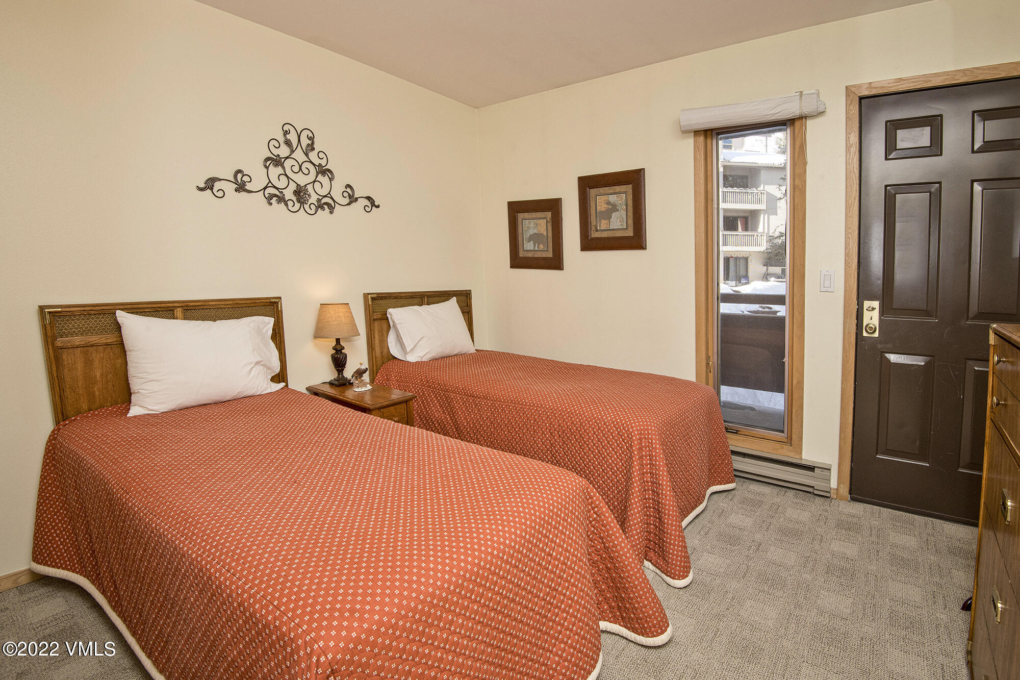 1030 Lions Ridge Loop, Unit 201 Vail, CO 81657 - Photo 21 of 29 a bedroom with two beds and painted walls