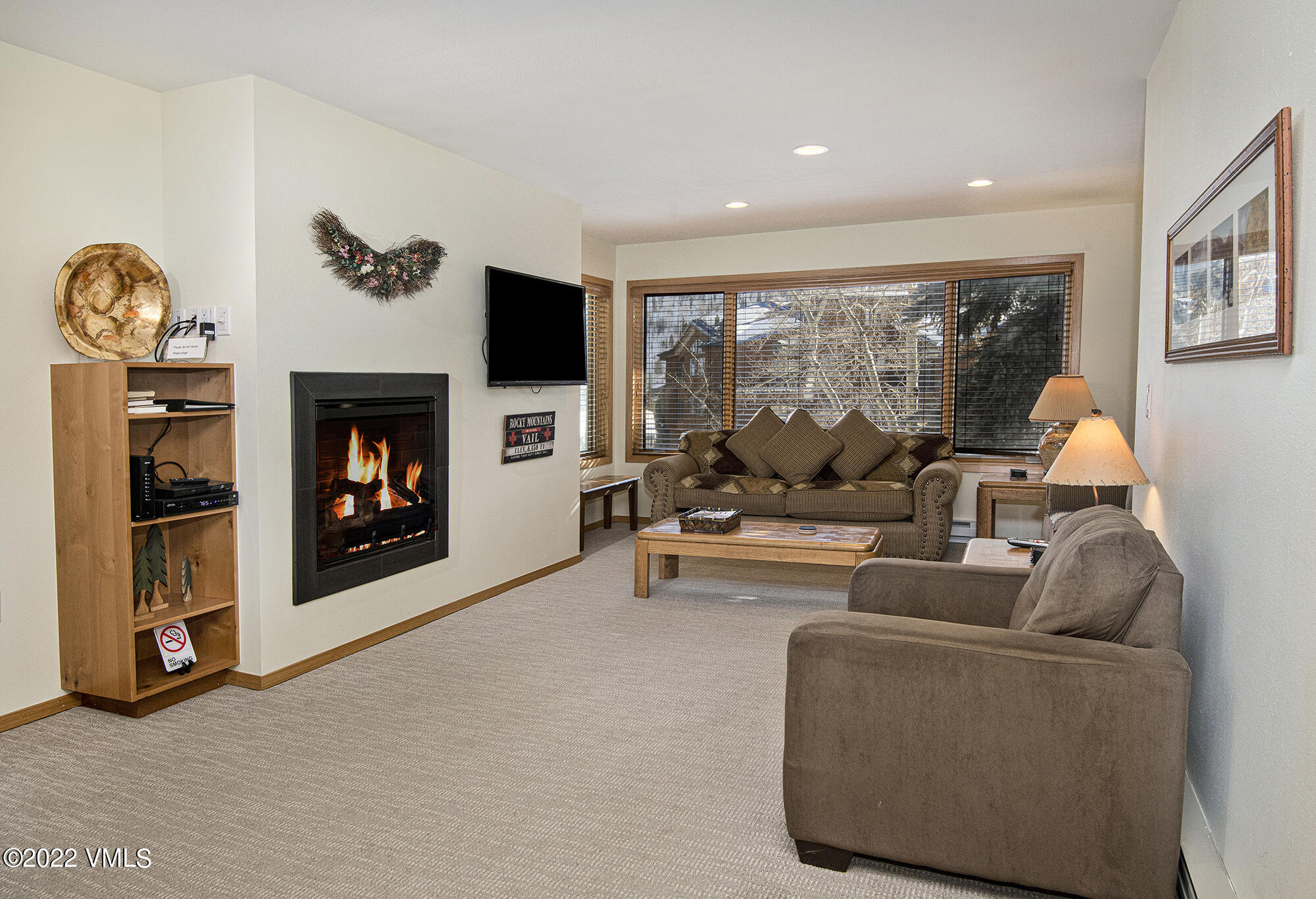 1030 Lions Ridge Loop, Unit 201 Vail, CO 81657 - Photo 5 of 29 a living room with furniture and a fireplace