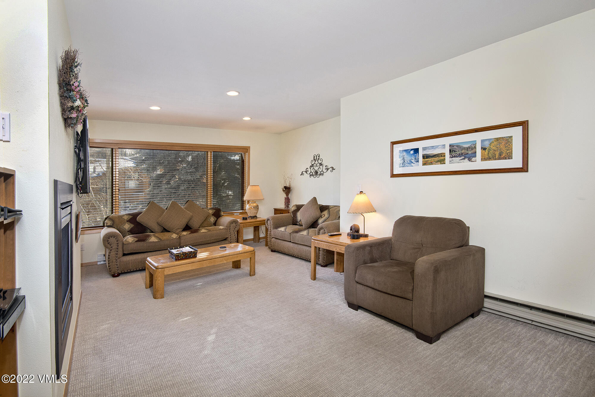 1030 Lions Ridge Loop, Unit 201 Vail, CO 81657 - Photo 6 of 29 a living room with furniture and a large window