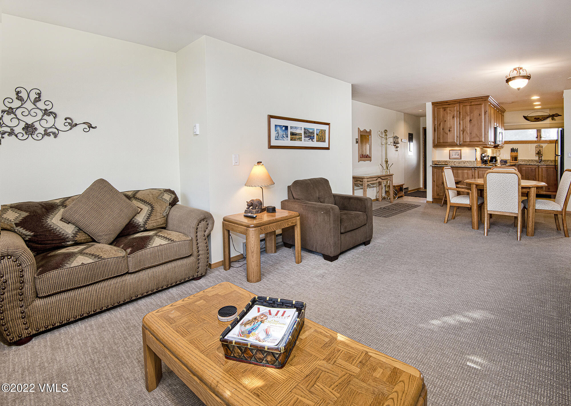 1030 Lions Ridge Loop, Unit 201 Vail, CO 81657 - Photo 7 of 29 a living room with furniture and a view of kitchen