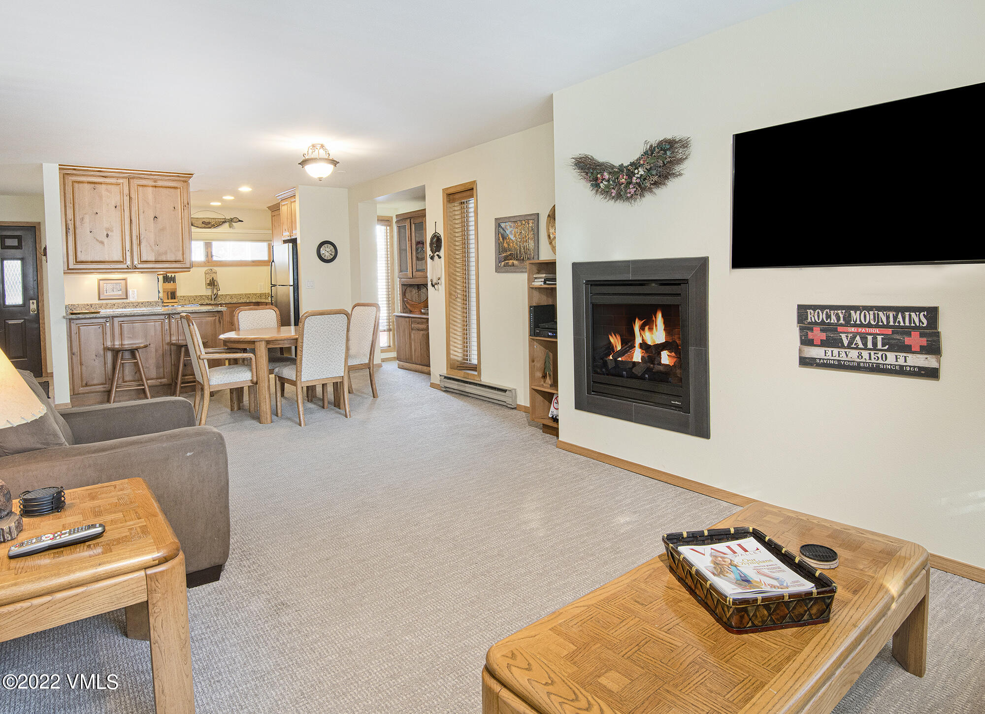 1030 Lions Ridge Loop, Unit 201 Vail, CO 81657 - Photo 8 of 29 a living room with furniture and a flat screen tv