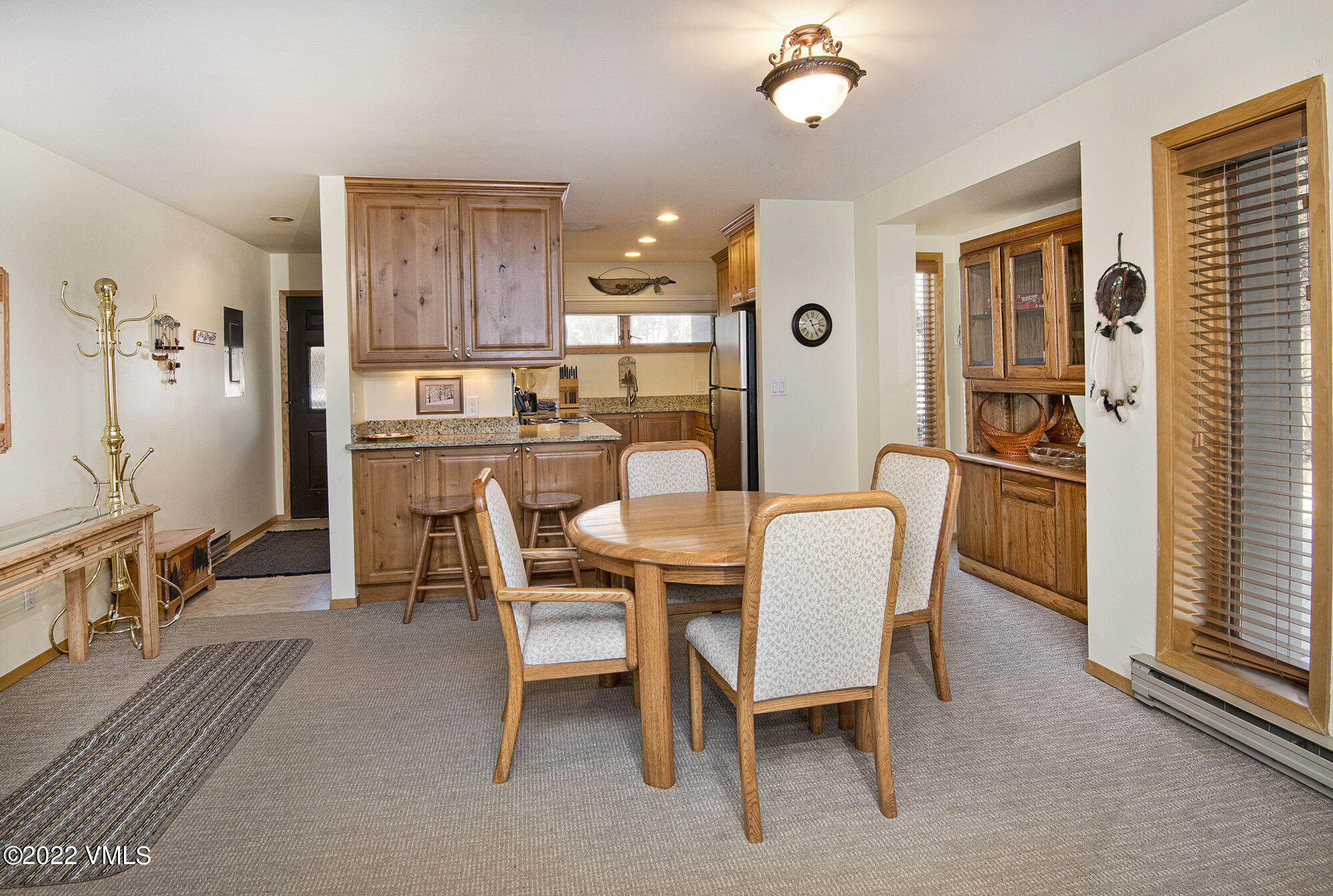 1030 Lions Ridge Loop, Unit 201 Vail, CO 81657 - Photo 9 of 29 a dining room with furniture and window