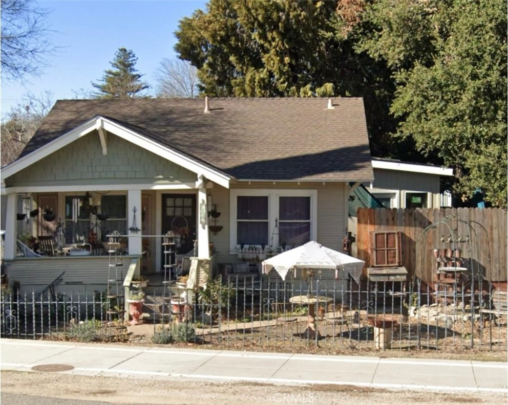 7300 Morro Road Atascadero, CA 93422 - Photo 3 of 3 a patio with a table and chairs under an umbrella