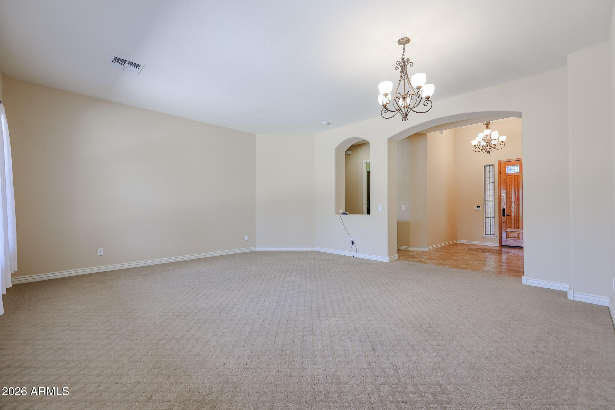 18175 West Narramore Road Goodyear, AZ 85338 - Photo 9 of 72 a view of empty room with chandelier