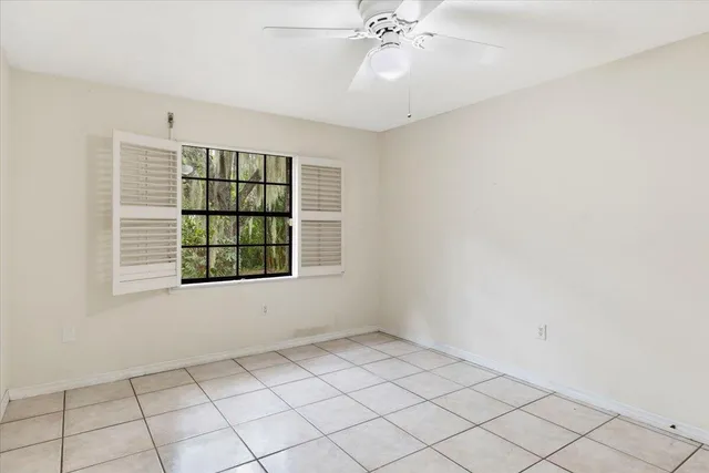a bed room with a bed and a view of bathroom