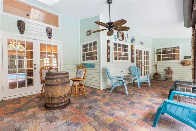 a view of balcony with wooden floor and outdoor seating