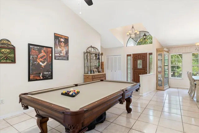 a view of a dining room with furniture wooden floor and chandelier