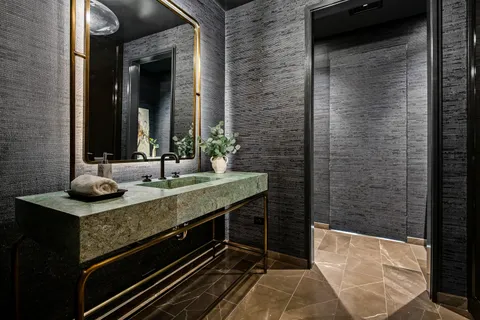 a bedroom with furniture and a flat screen tv