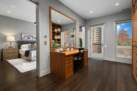 a bathroom with a granite countertop sink a mirror and shower