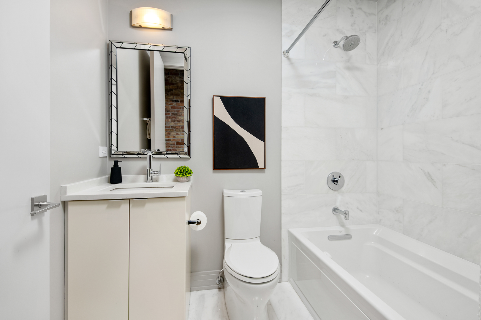 416 West Deming Place, Unit 4 Chicago, IL 60614 - Photo 25 of 36 a bathroom with a granite countertop sink toilet and mirror