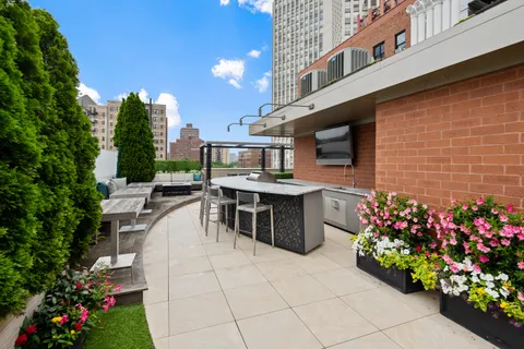 a view of a chairs and table in the patio