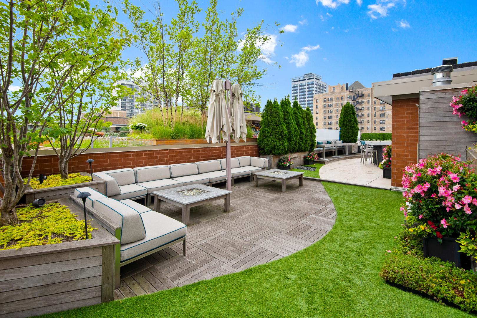 416 West Deming Place, Unit 4 Chicago, IL 60614 - Photo 29 of 36 a view of a patio with couches and a fire pit and wooden fence