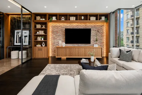 a dining room with furniture and wooden floor