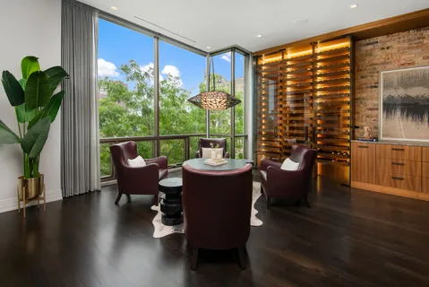 a outdoor dining space with furniture and a potted plant