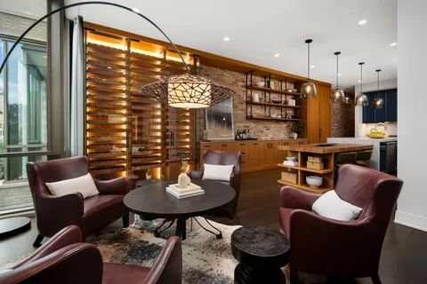 a kitchen with a sink appliances and cabinets