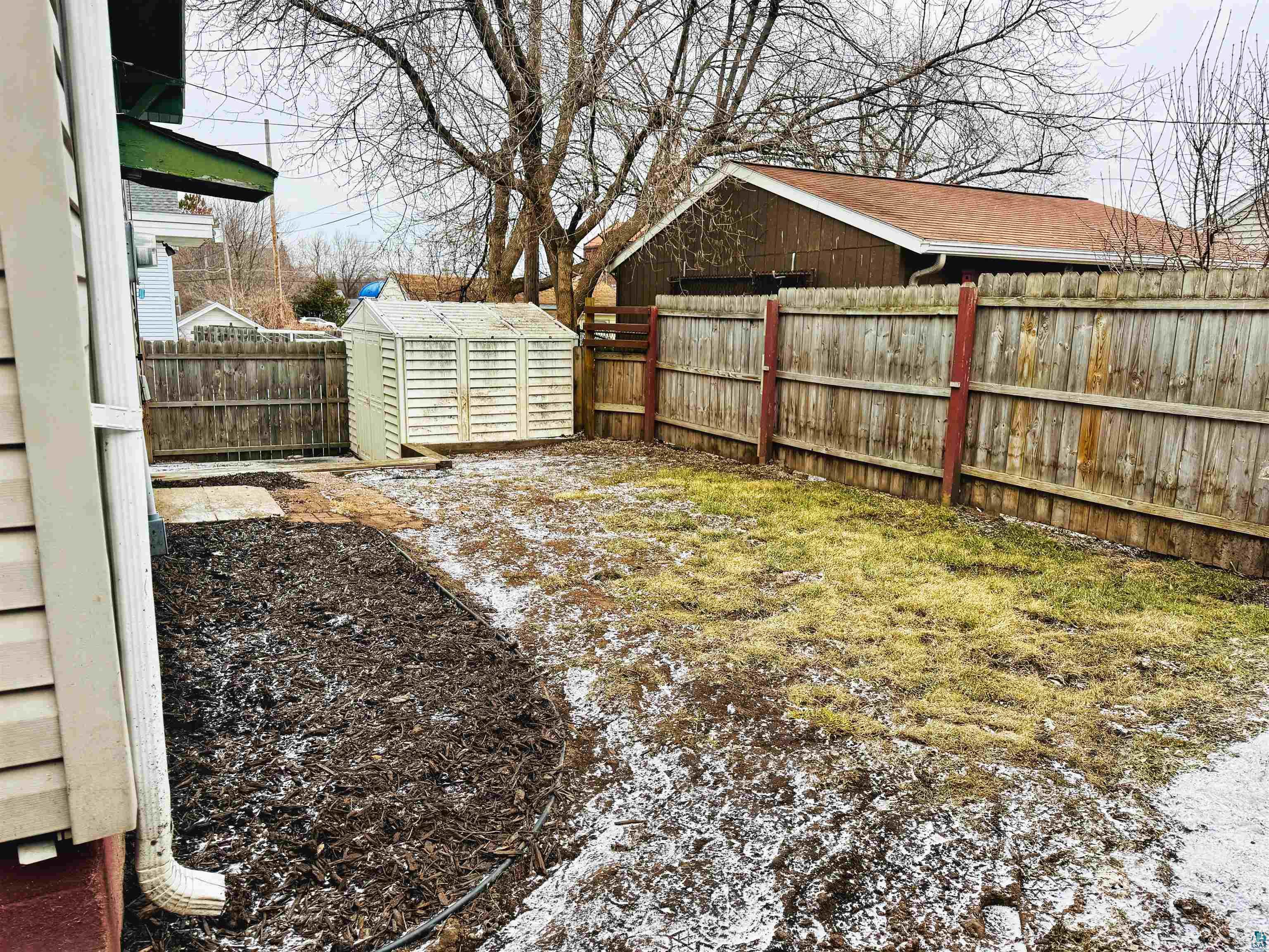 216 3rd Street Cloquet, MN 55720 - Photo 35 of 46 Some grass beneath the snow