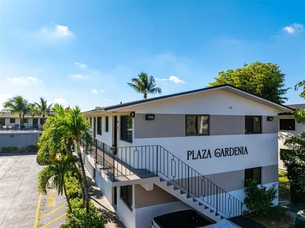 a front view of house along with deck and outdoor space