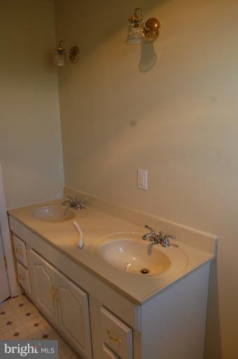 10514 Liberty Road Frederick, MD 21701 - Photo 7 of 17 a bathroom with a sink and vanity