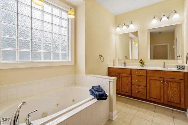 a bathroom with a granite countertop toilet a sink and bathtub