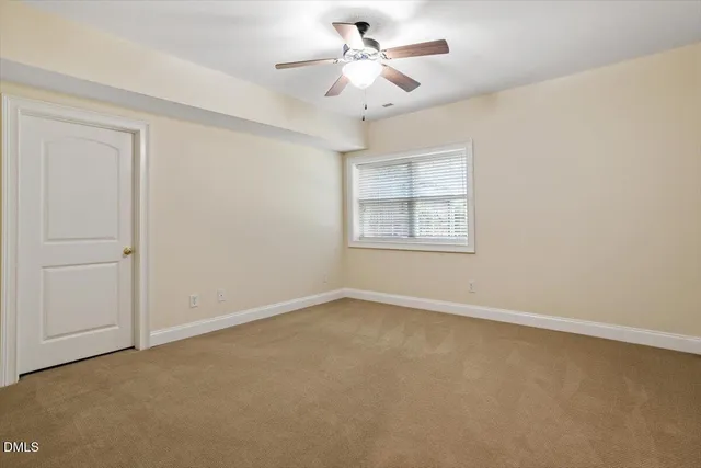 a view of a house with a yard and plants