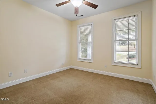 a view of a kitchen with cabinets and wooden floor