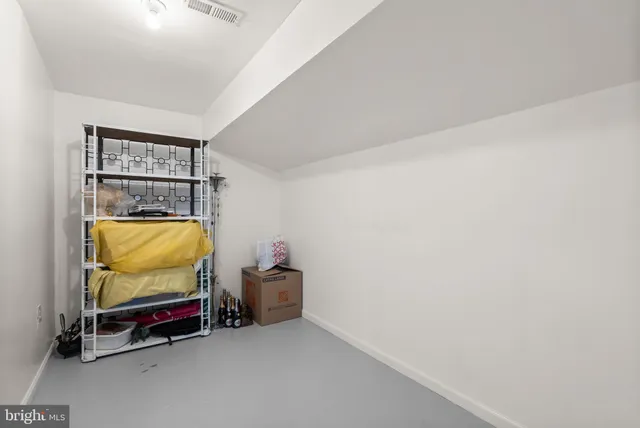 a room with storage and pool table