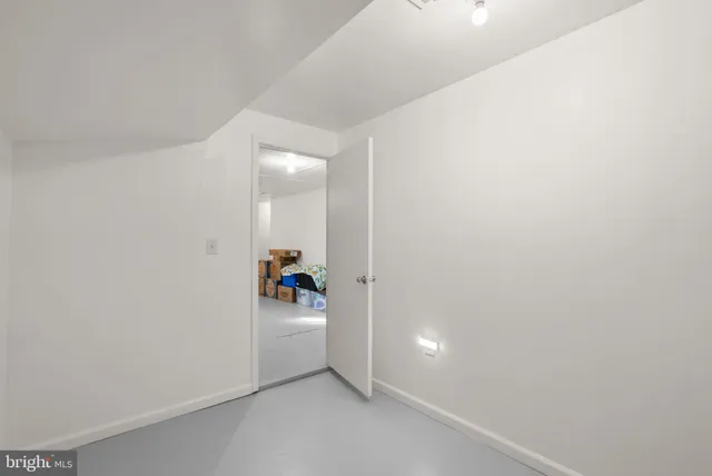 a view of storage and utility room with closet dryer and washer