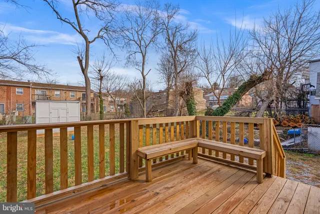 a view of a house with a big yard and large trees