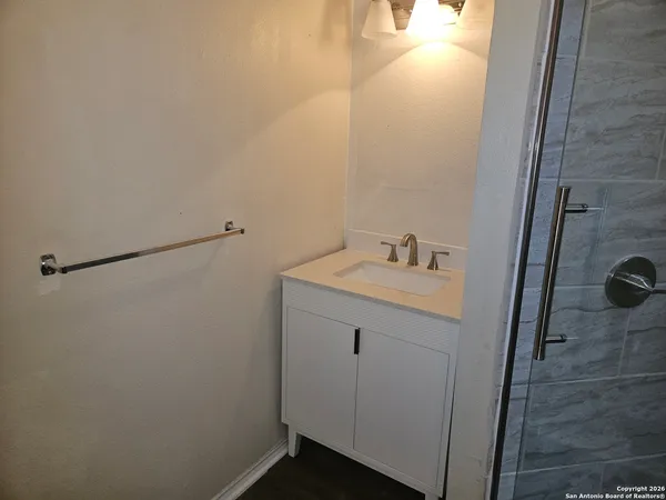 a bathroom with a sink and mirror