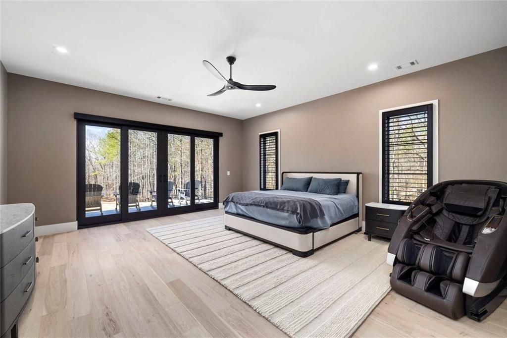 2309 Dinsmore Road Milton, GA 30004 - Photo 25 of 87 a spacious bedroom with a bed and a large window