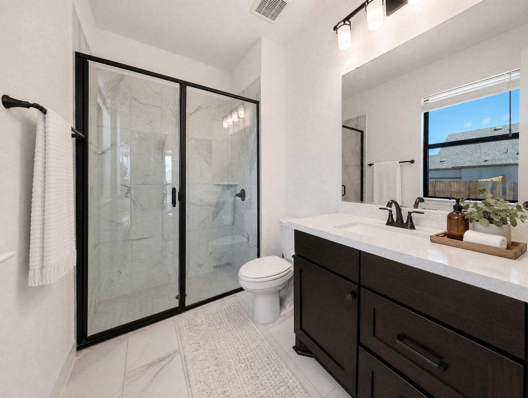 1440 Riva Ridge Drive Leander, TX 78641 - Photo 17 of 37 A well-appointed bathroom features a spacious walk-in shower and a modern vanity.