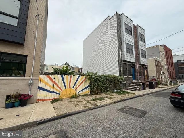 a view of a street with cars