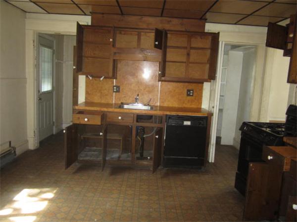 104 Fenwick Street Springfield, MA 01109 - Photo 6 of 12 a kitchen with a sink and cabinets