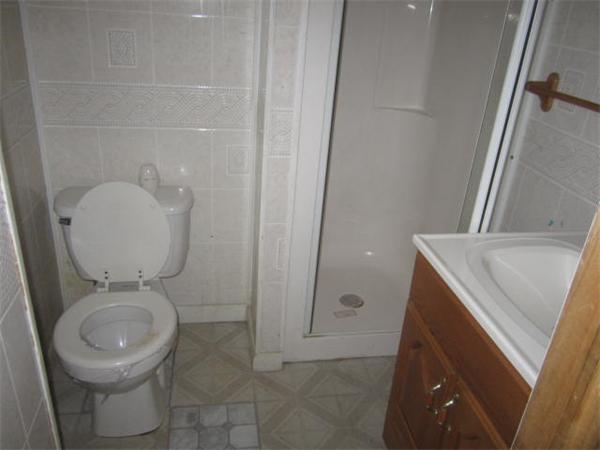 104 Fenwick Street Springfield, MA 01109 - Photo 8 of 12 a bathroom with a toilet and a sink
