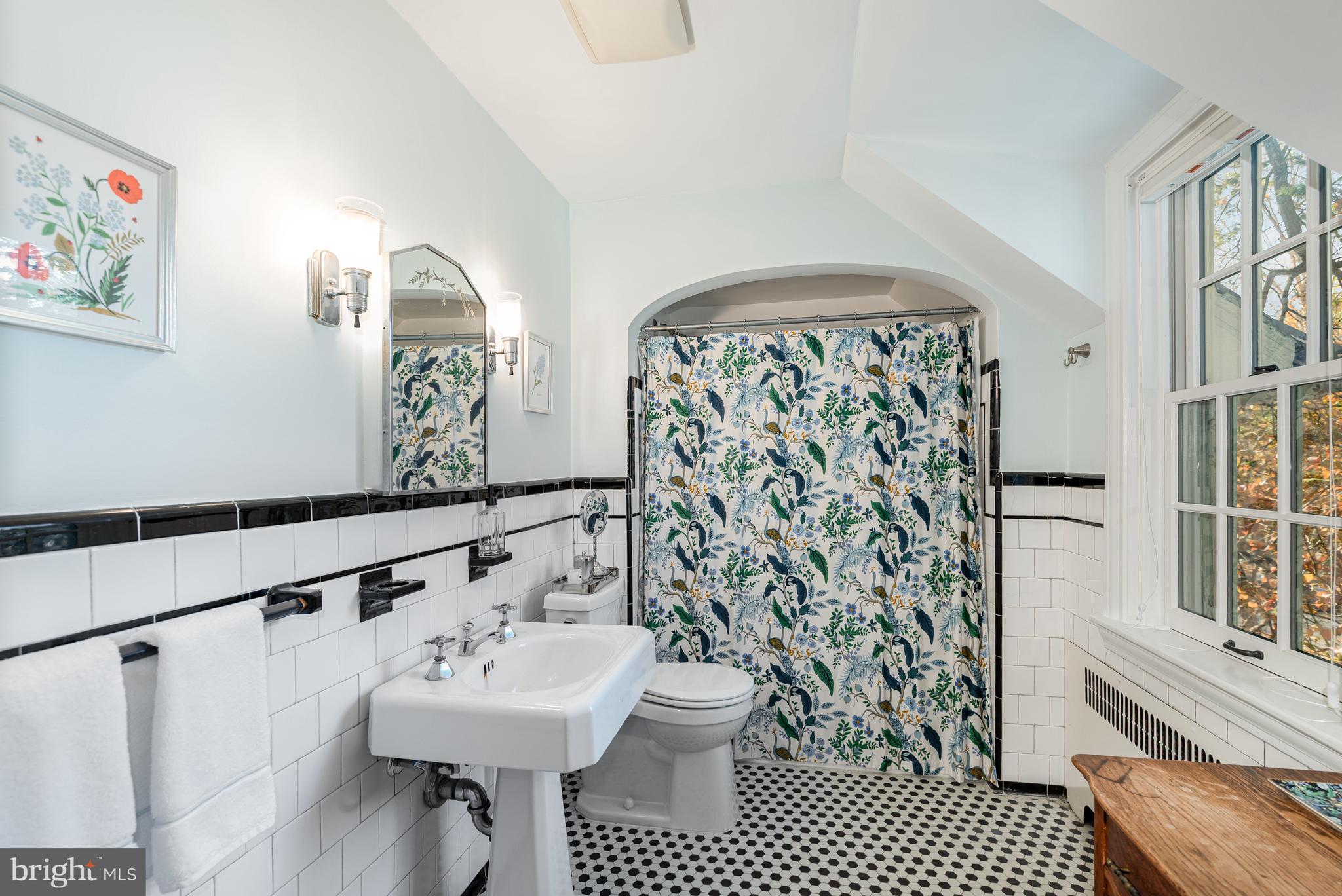 4413 Sedgwick Road Baltimore, MD 21210 - Photo 17 of 52 a bathroom with a sink toilet and shower